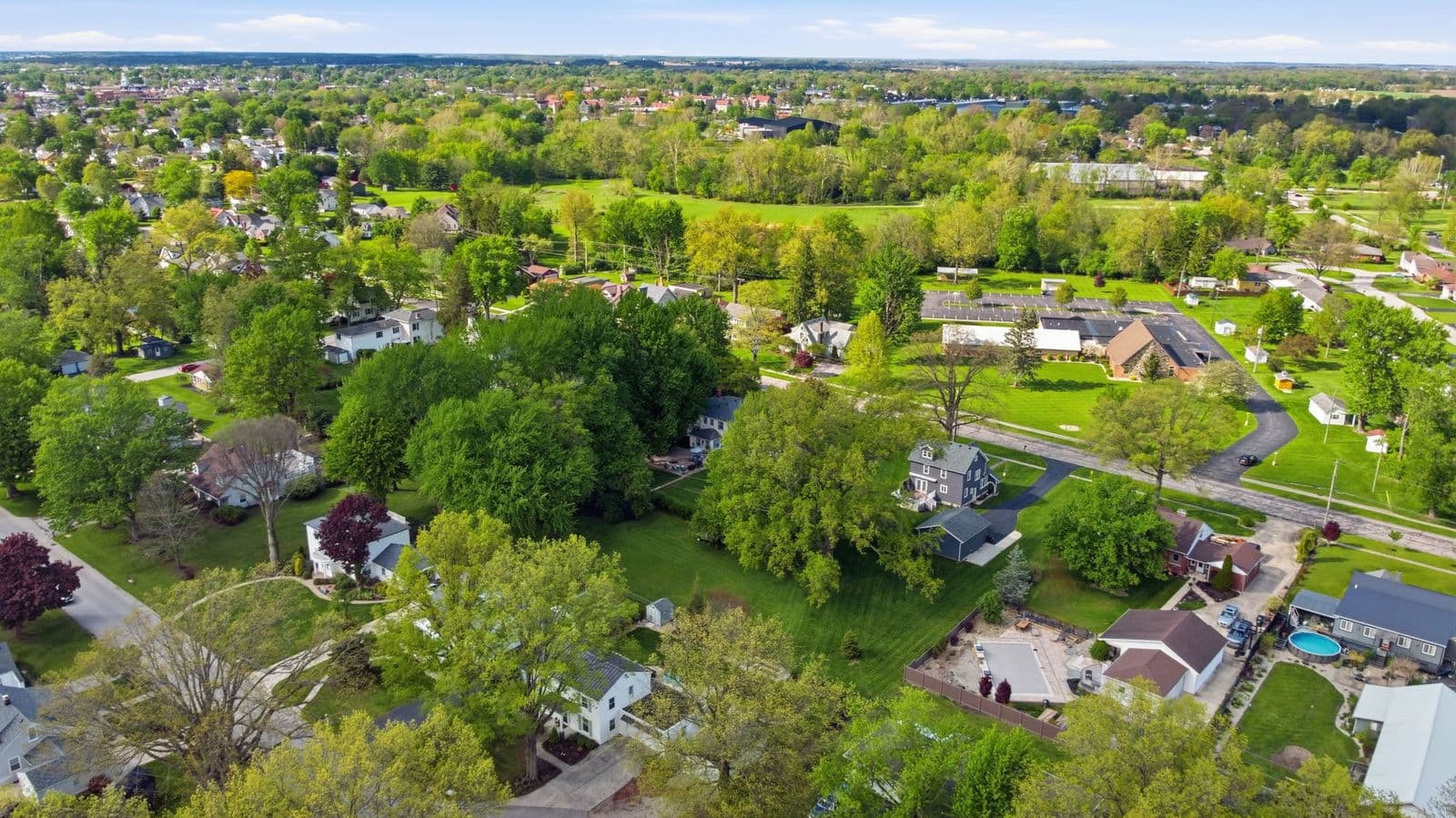 Drone aerial over the neighborhood at 400 Coe St beside Hedges-Boyer Park