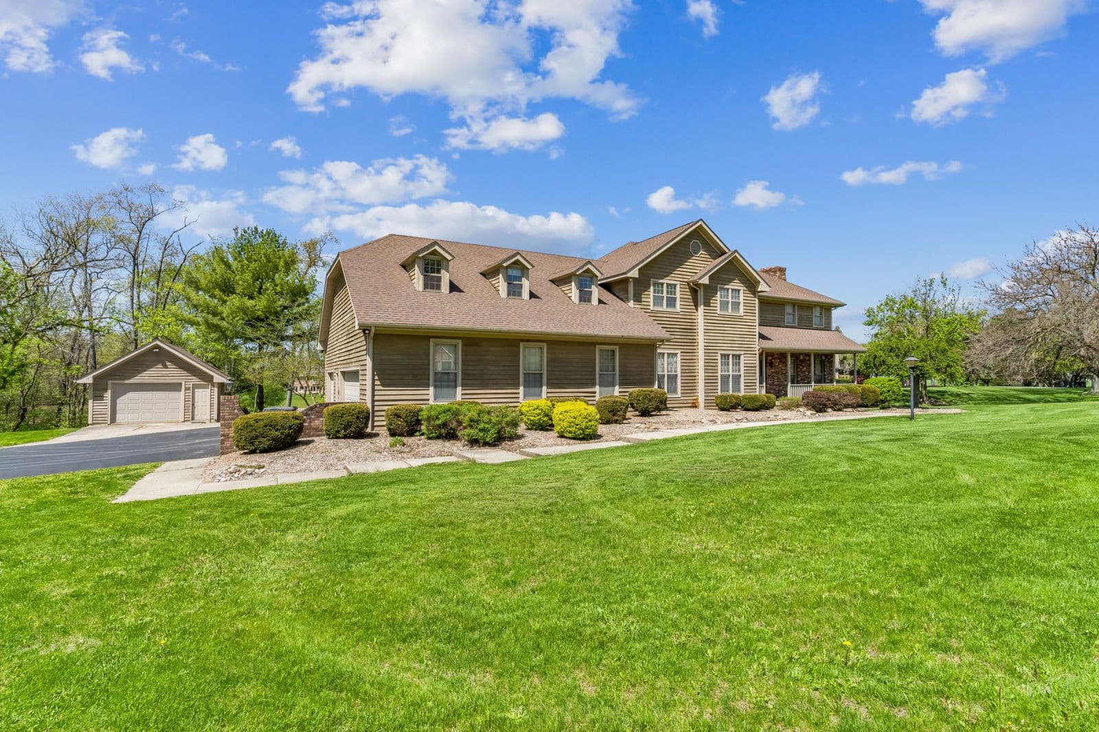 Professional exterior photograph of 125 W Woodmere Dr, Tiffin